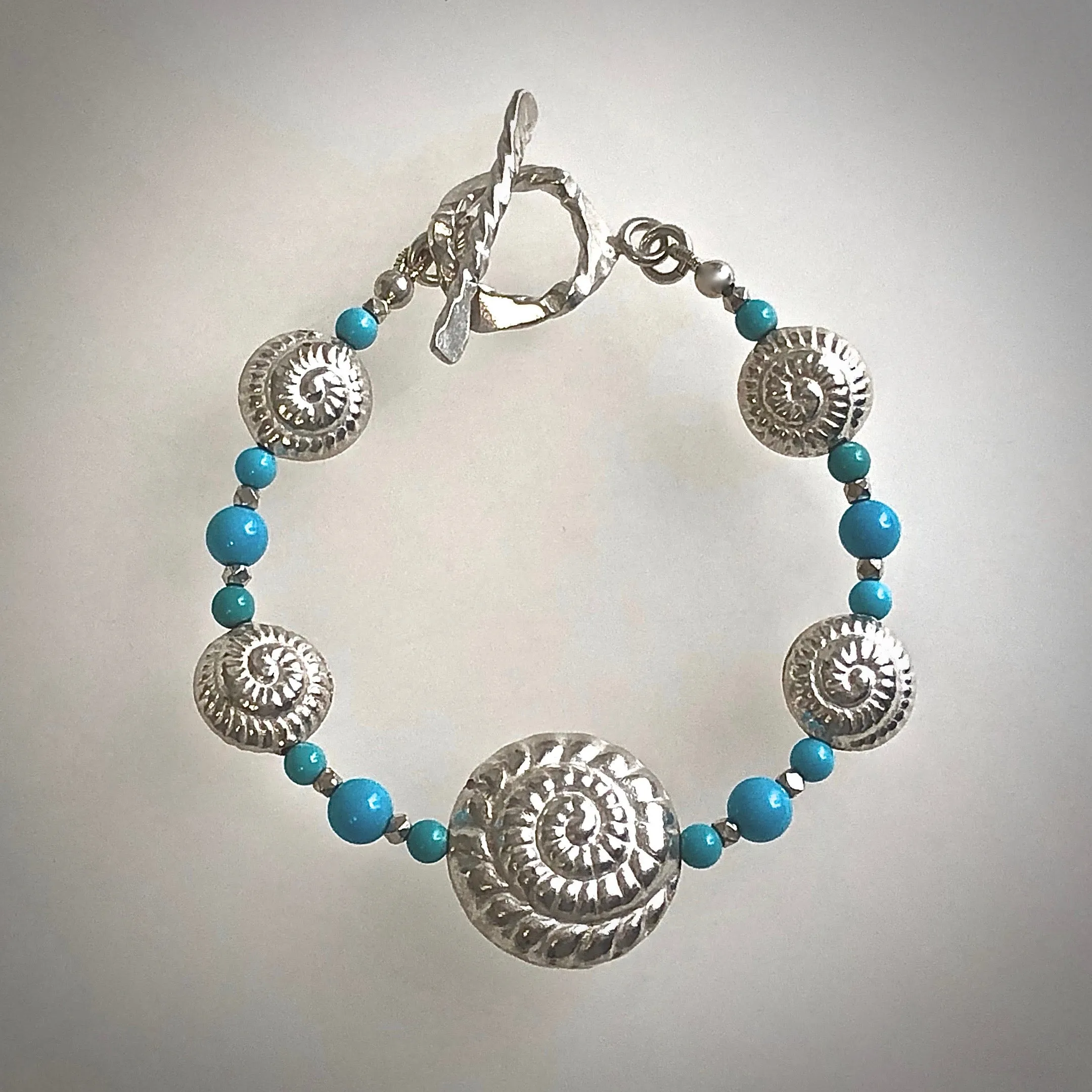 8" one of a kind Nautilus Shell Bracelet in artisan-crafted 999 Fine Silver with Sleeping Beauty Turquoise