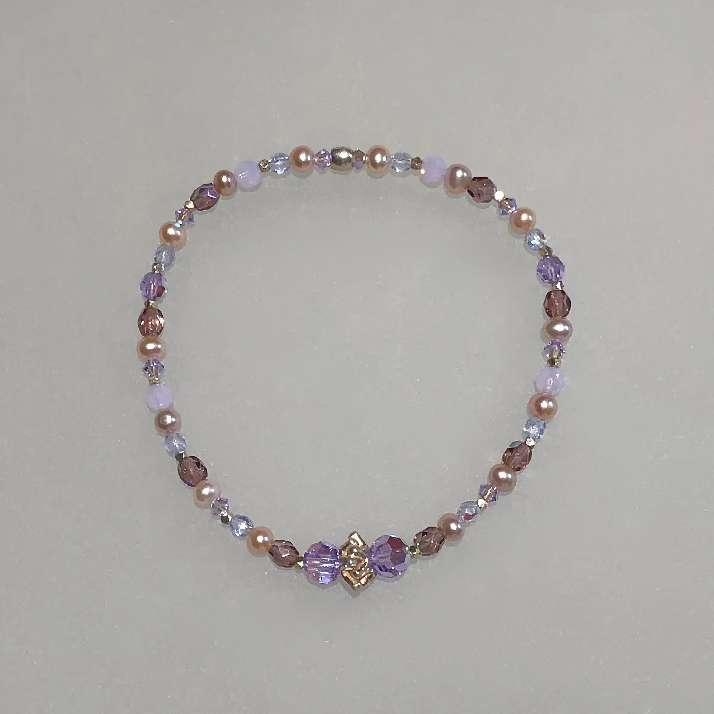 Arpaia 7.25" one of a kind stretch bracelet with cultured pearls, glass, Swarovski crystal, and artisan-crafted 999 fine silver.