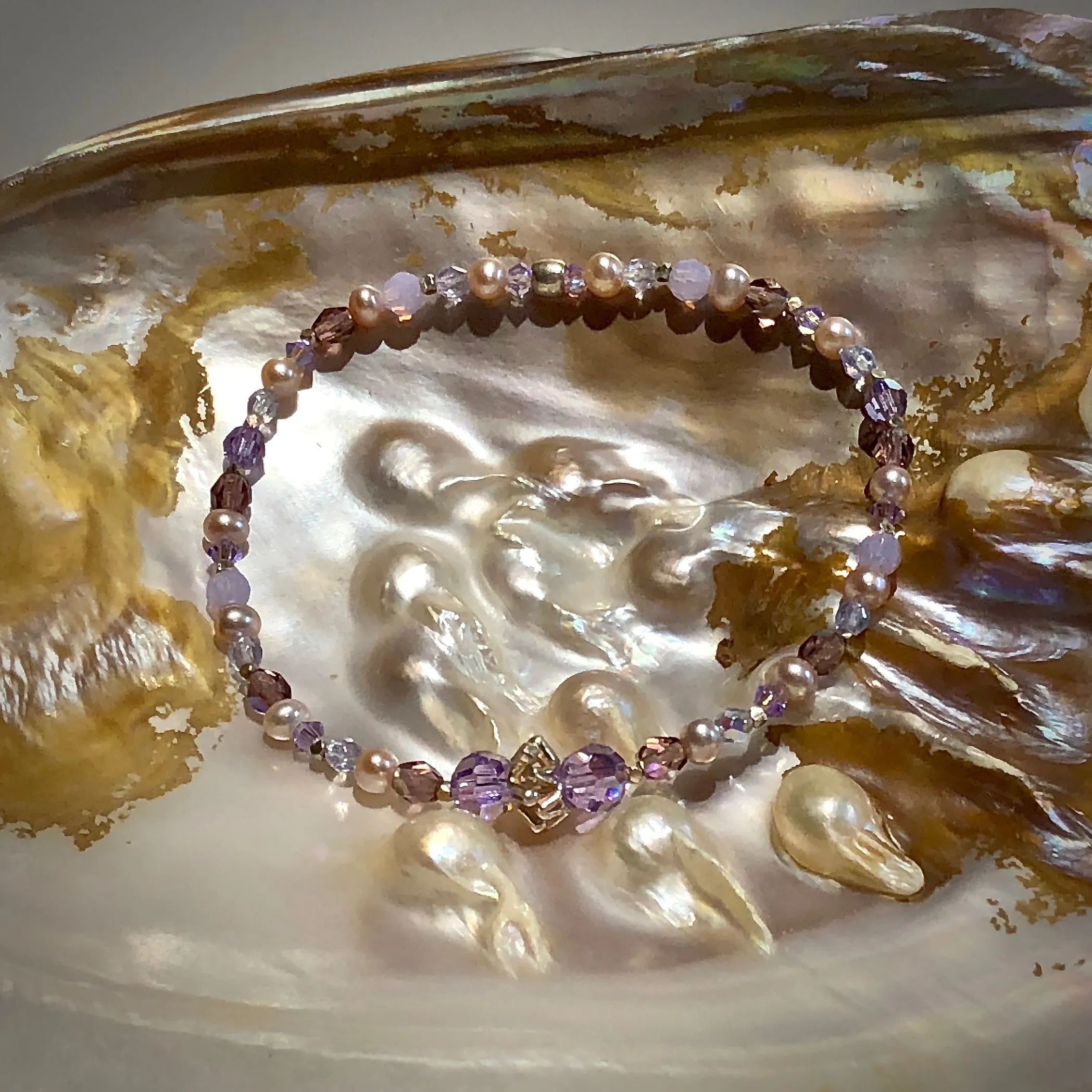 Arpaia 7.25" one of a kind stretch bracelet with cultured pearls, glass, Swarovski crystal, and artisan-crafted 999 fine silver.