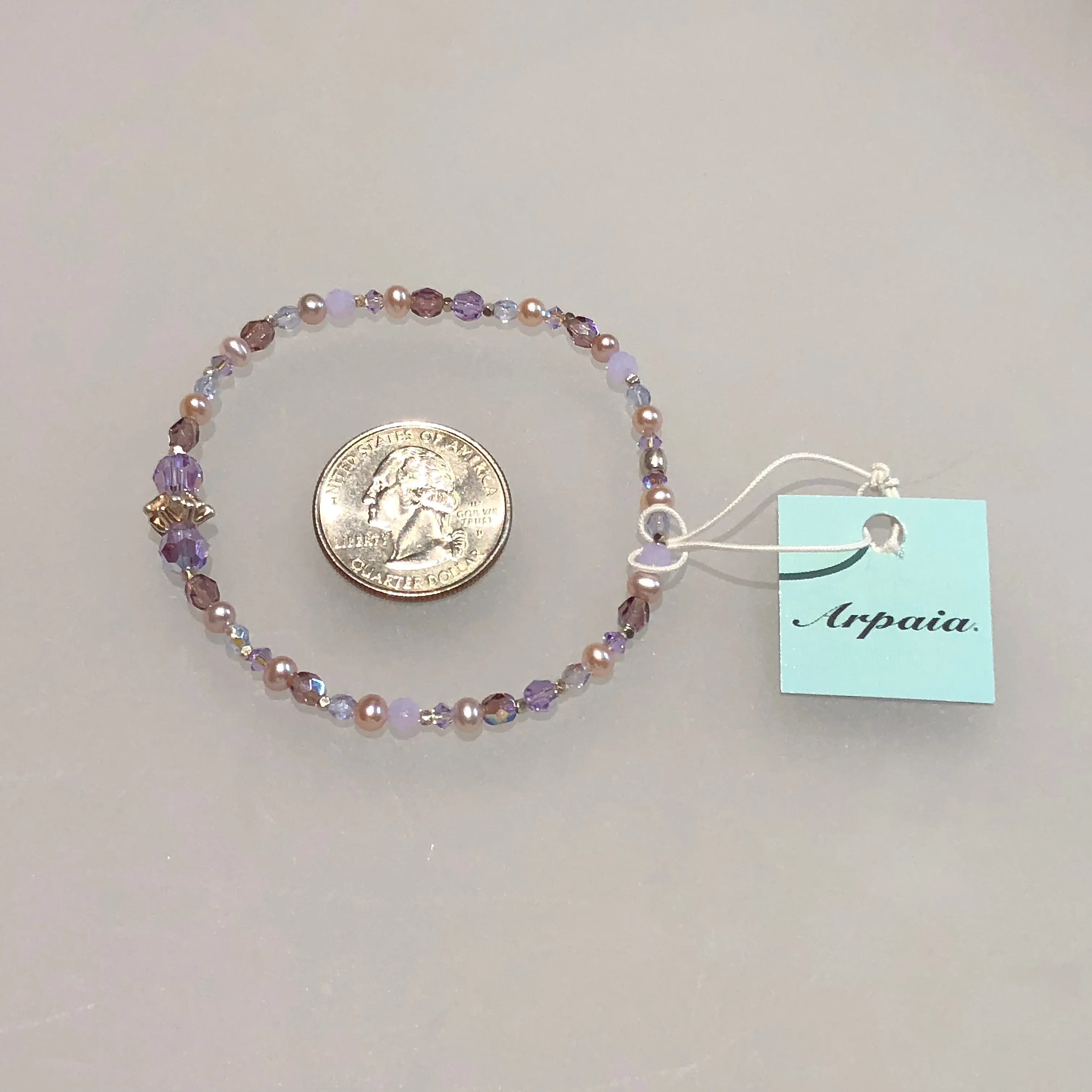 Arpaia 7.25" one of a kind stretch bracelet with cultured pearls, glass, Swarovski crystal, and artisan-crafted 999 fine silver.