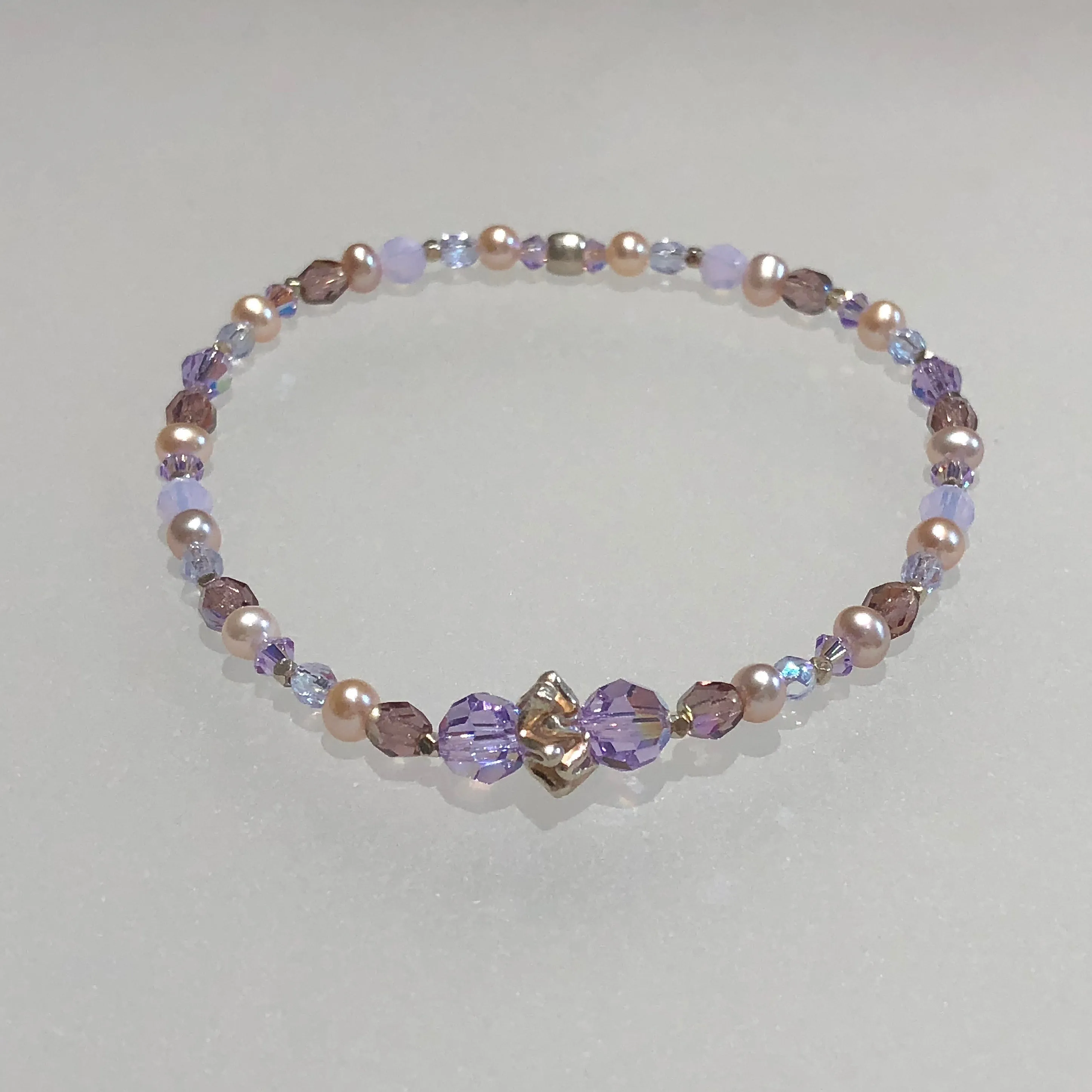 Arpaia 7.25" one of a kind stretch bracelet with cultured pearls, glass, Swarovski crystal, and artisan-crafted 999 fine silver.