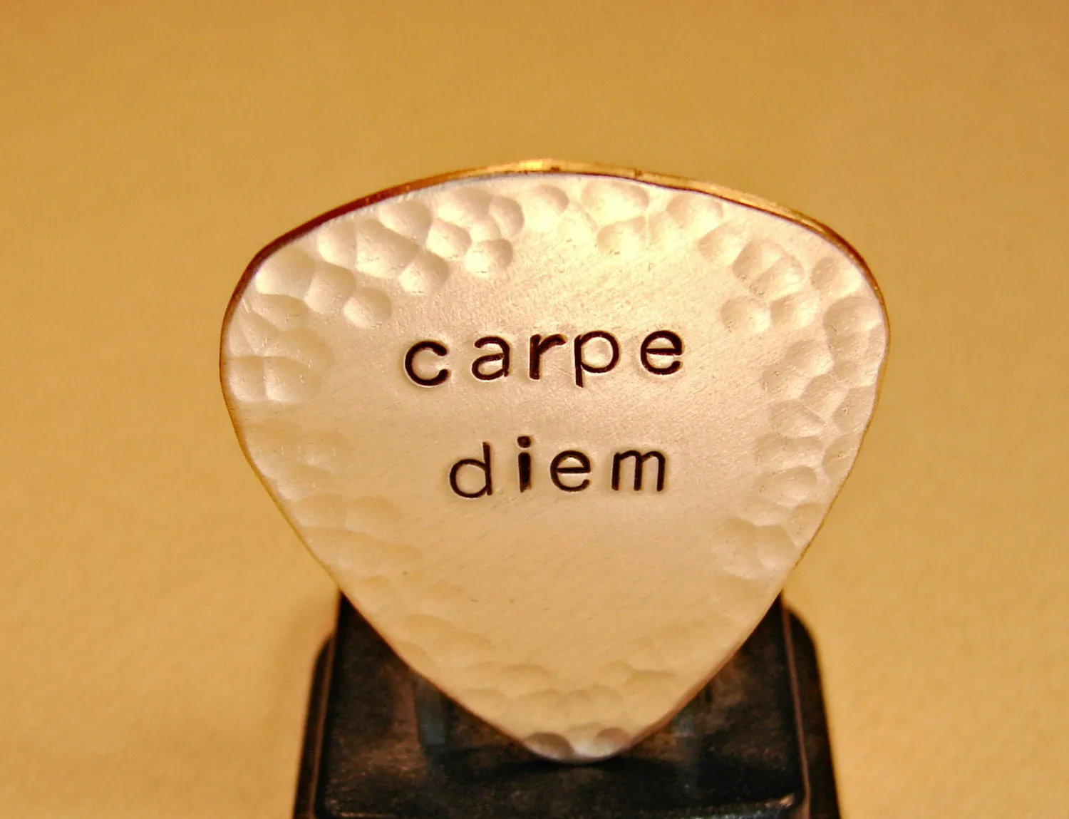 Carpe diem guitar pick with hammered edges in bronze