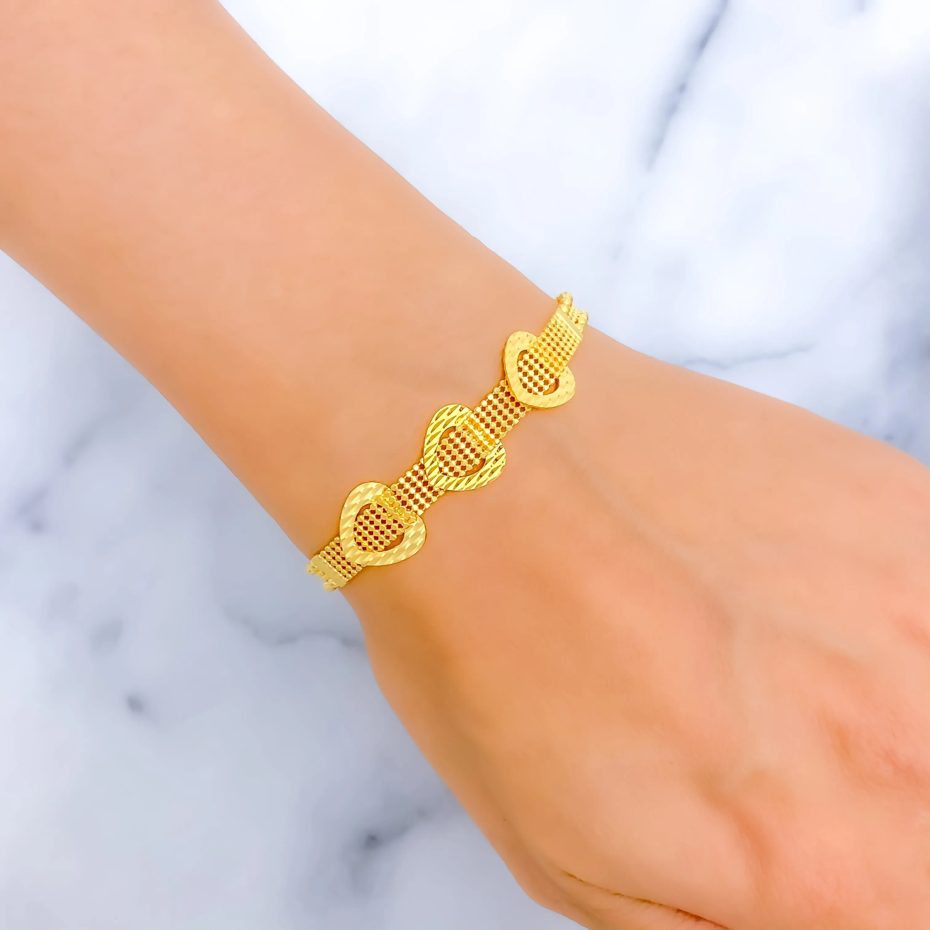 Dazzling Triple Heart 22k Gold Bracelet