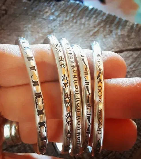 Sterling silver stacking bracelets with hand stamped patterns as singles or a set