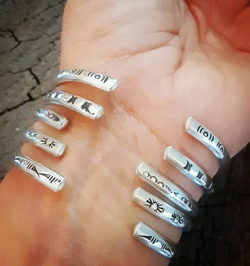 Sterling silver stacking bracelets with hand stamped patterns as singles or a set