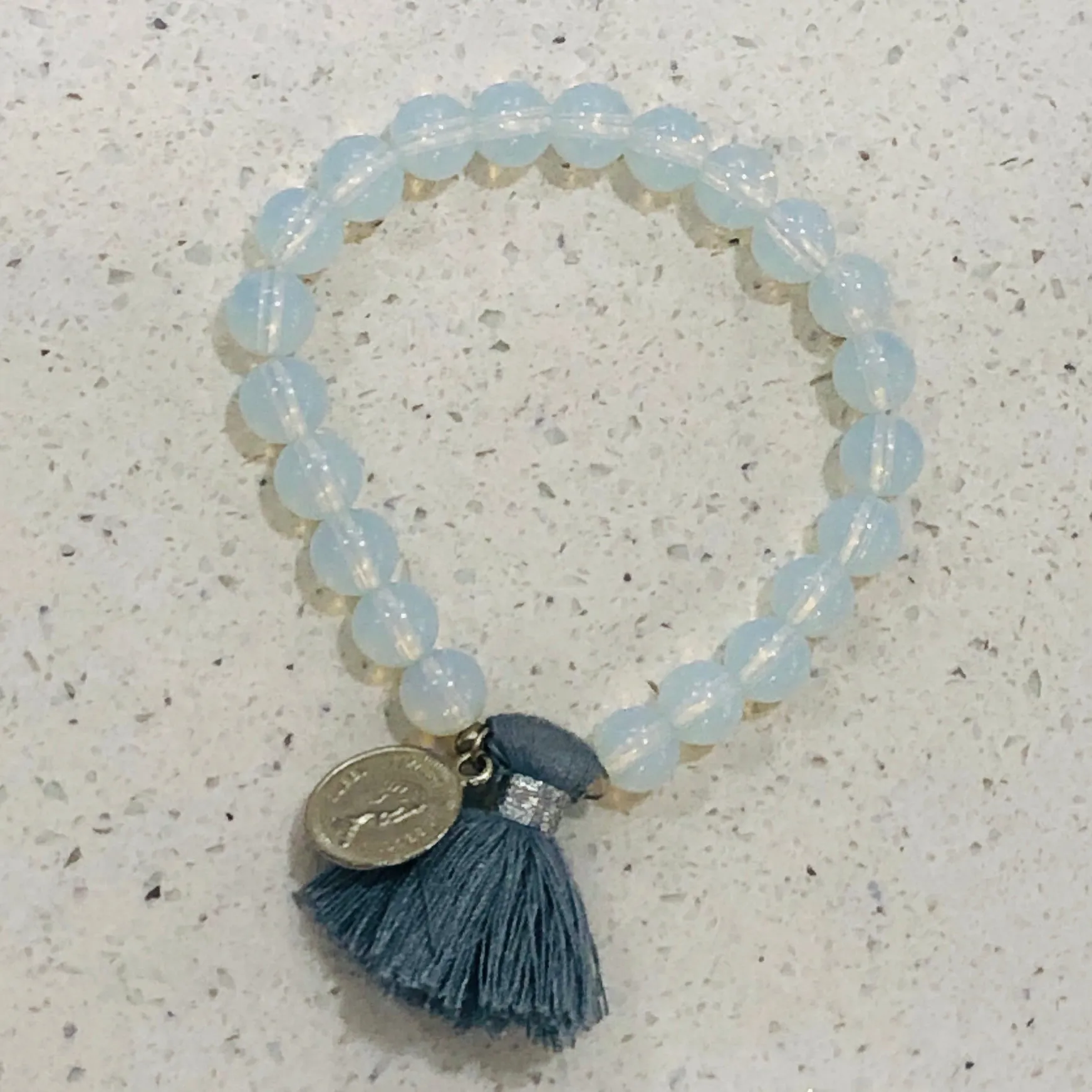 TM. Moon Bead Coin & Tassel Bracelet